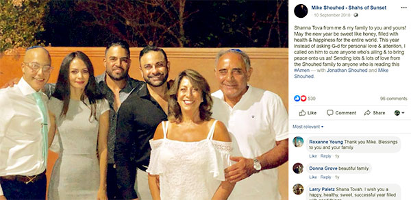 Image of Caption: Mike Shouhed with parents, brother, and family